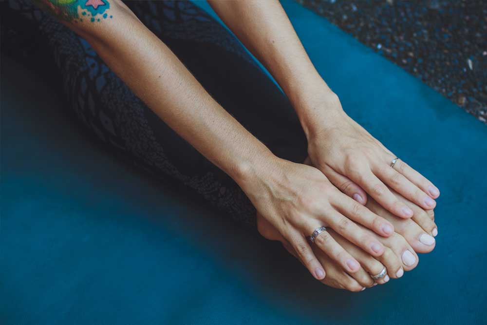 Woman stretching legs and arms